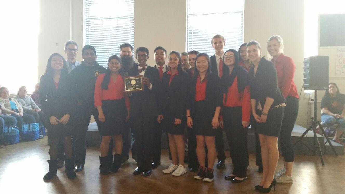 The 2015-2016 Mock Trial team poses for a quick picture with their award after finishing second in the San Joaquin County Competition.
