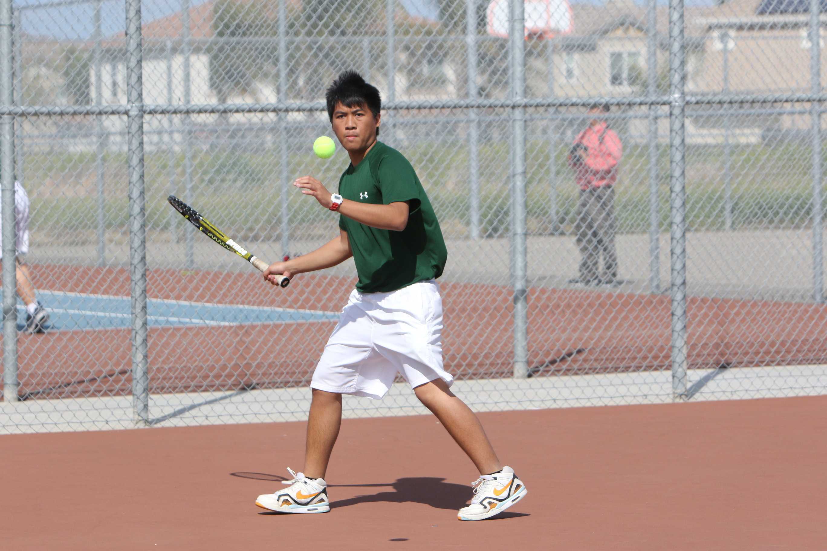 Senior Jeane Taruc gets ready to hit the ball back to Kimball's side of the court on Mar. 14.