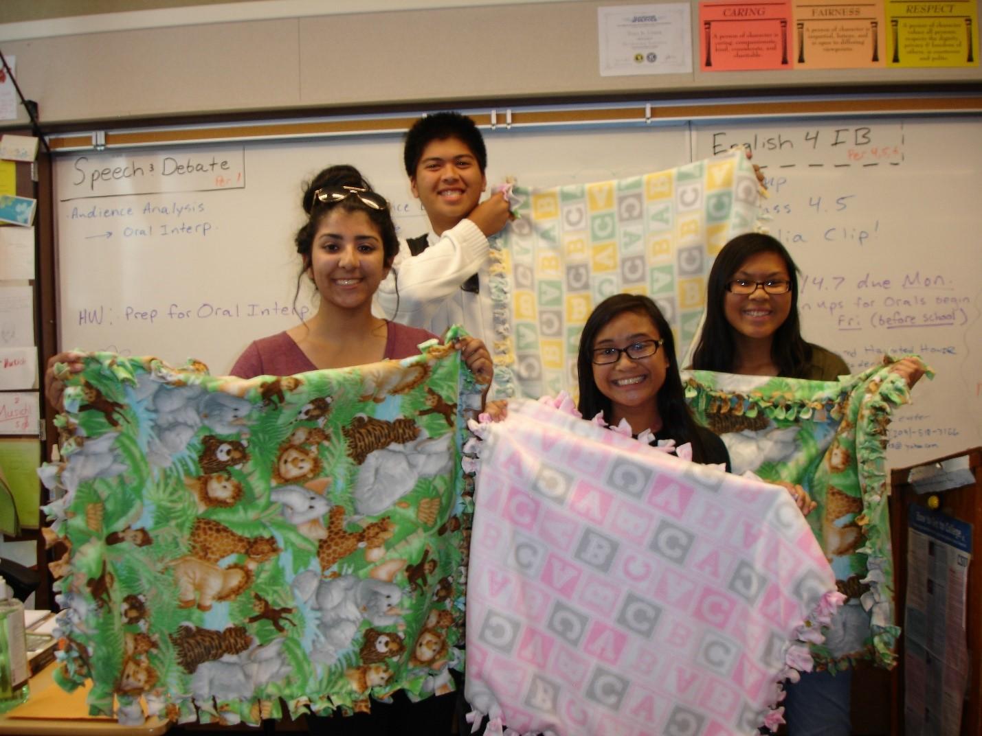 Key Club’s seniors, Huda Nauman, Abi Pineda, Errold Alba, and Jenna Valenzona proudly hold the blankets they created to donate to babies in need.