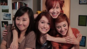 The characters of The Lizzie Bennet Diaries smile for the camera.