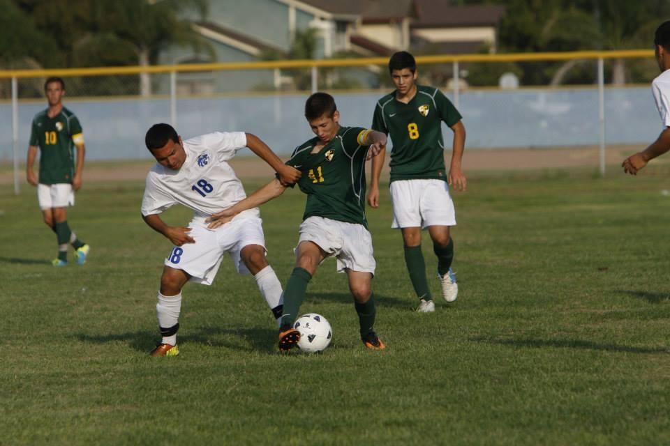 Jacob Gonzalez is trying to take the ball away from the opponent