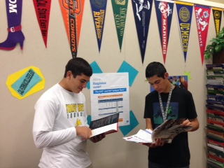 Senior Chris Coykendall and junior Blake Lazar view information on colleges.