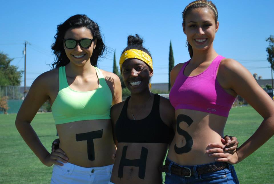 Brianna Hernandez, Minyon Spencer, and Jill Finney show off their THS body paint. 