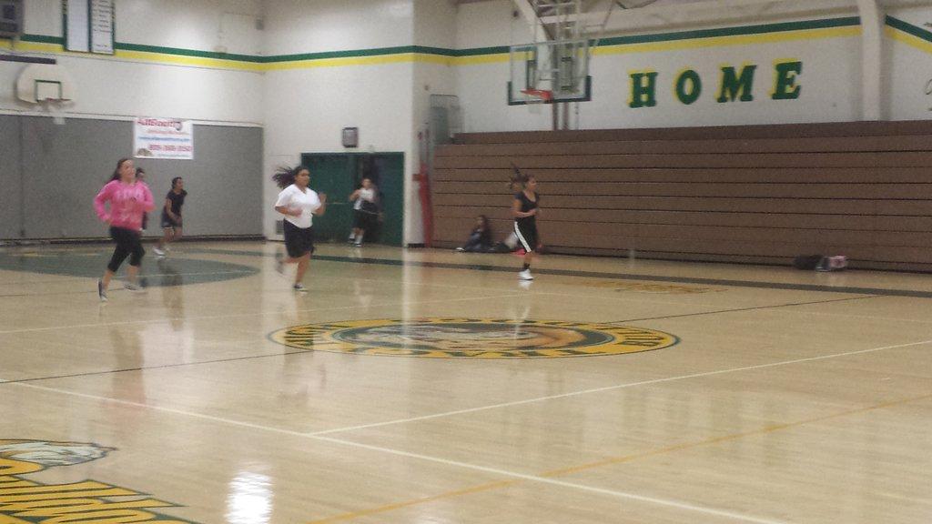 Couple of girls running to get in shape for basketball for upcoming season