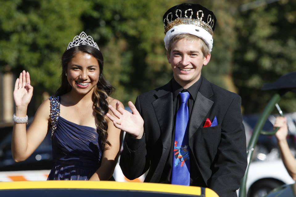 Ruth Alvarez and Beau Mantor smile during the homecoming parade. 