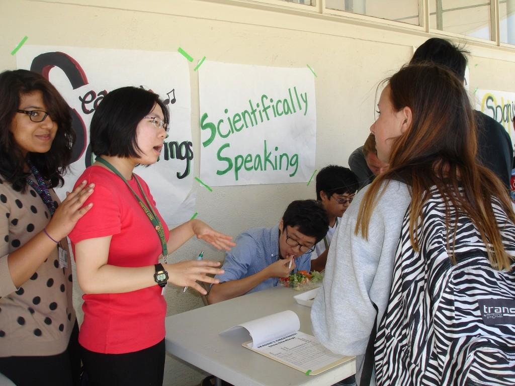 Senior Sarah Bai teaches students why they should join Seasons Greetings club.