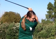 Brooke Davis finishes her swing during  a match.