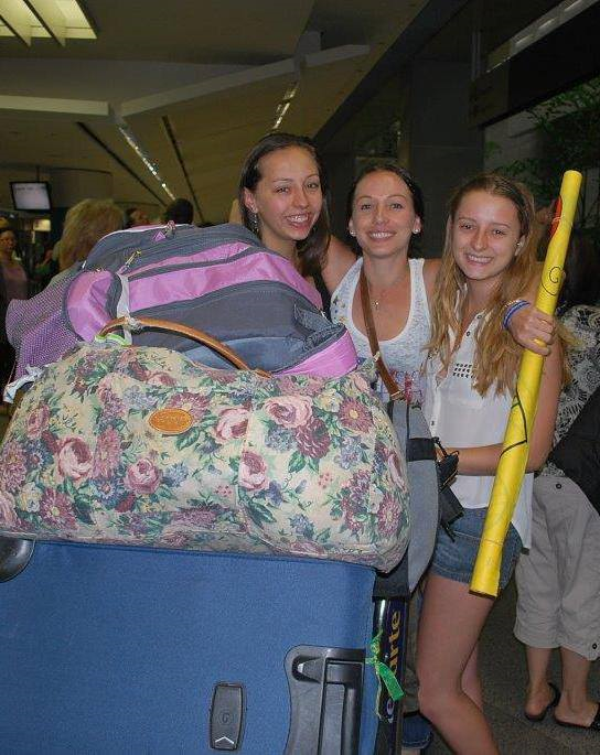 At the air port picking up my sister Ashley after she spent eight months in Spain. Left to right: Ashley, Leeann, and myself.