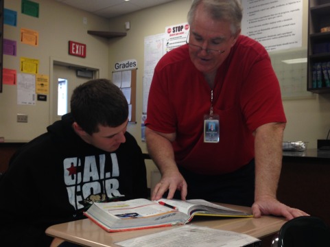 Mr. Dibler helping Thomas Greely, sophomore, with his chemistry homework.