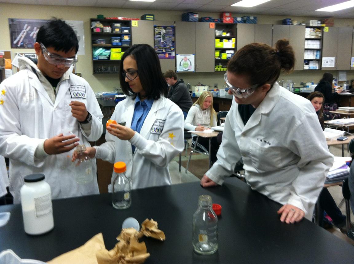 Erin McKay observing students during a lab