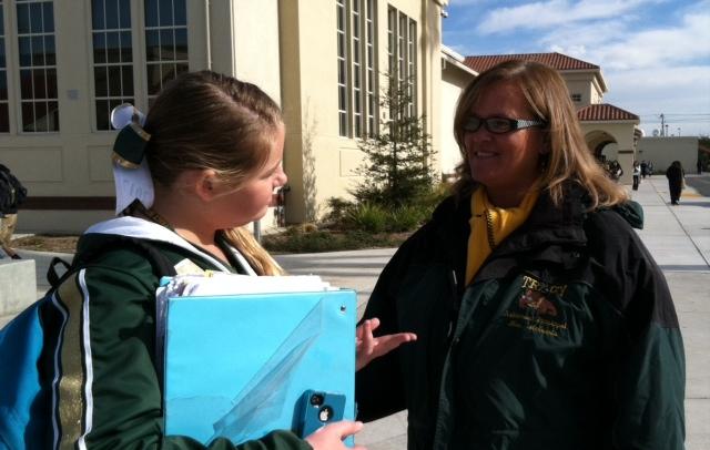 Assistant Principle Joni McGinnis talking with a student