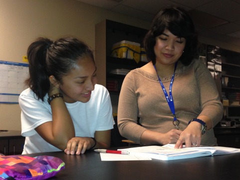 Ms. Pabalan helps freshman Deanna Cardenas with her biology homework.