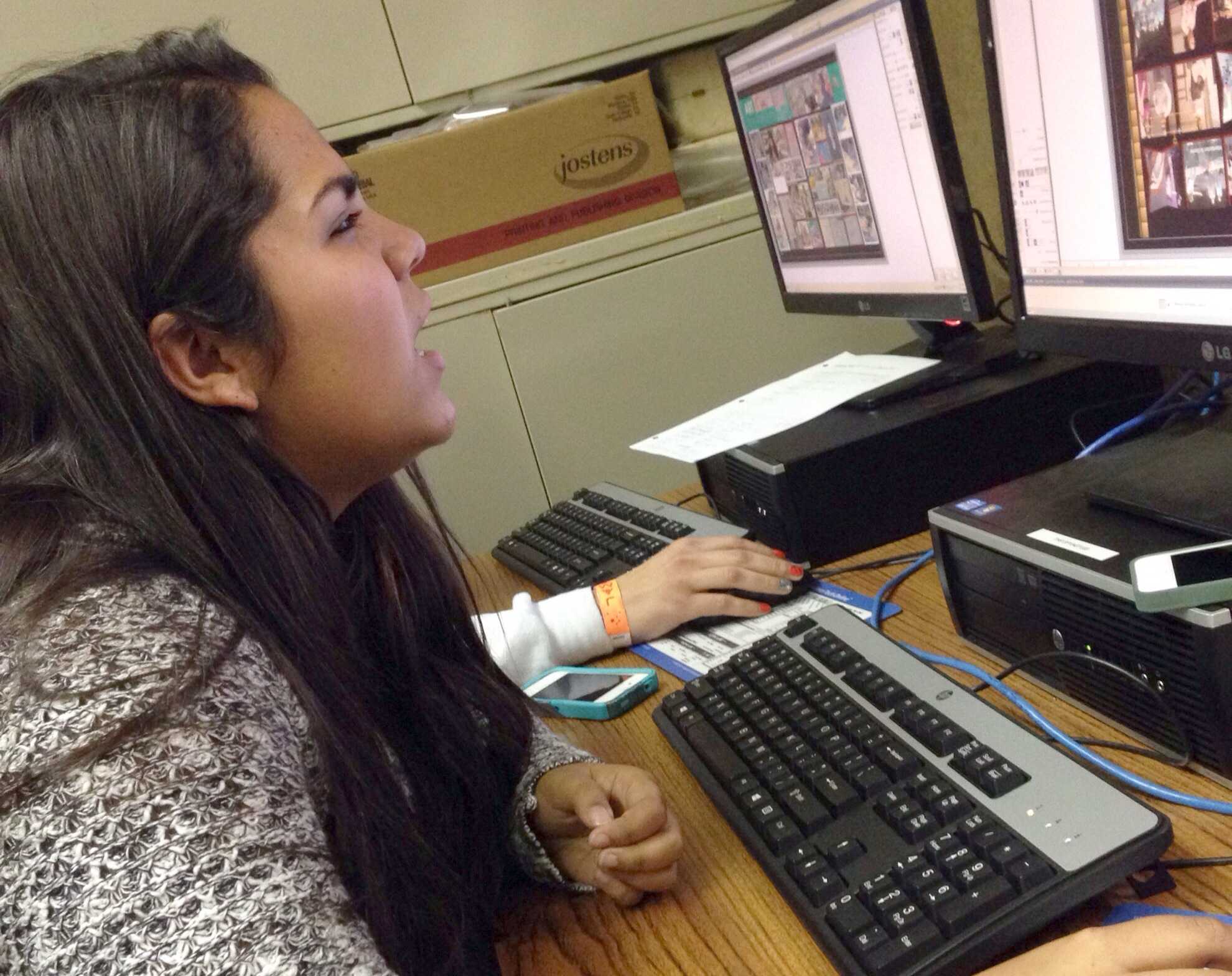 Yearbook student Tania Torres works on a yearbook page.