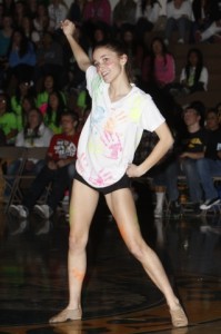 Senior Lauren Perry shows off her moves with the dance team at the Black Light rally.