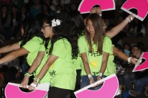 Sophomore Christina Suarez (left) performs with the club Asian Pacific Islanders (API) at the Black Light rally.