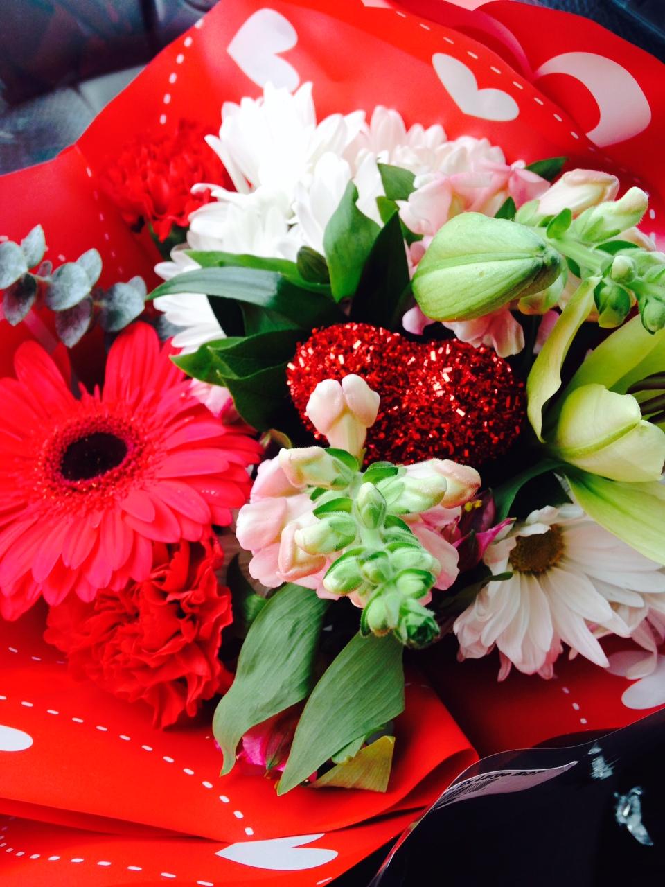 Girls receive beautiful bouquets of flowers on Valentines Day.
