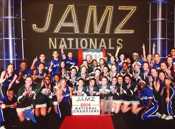 Tracy Highs competition cheer team poses with the first place trophy at the national competition in Las Vegas.