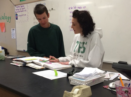 Science teacher Melissa Kalis assists junior Dylan Sandoval with classwork in her fourth period Human Physiology class.