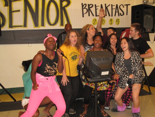 A group of seniors sing karaoke at Senior Breakfast.