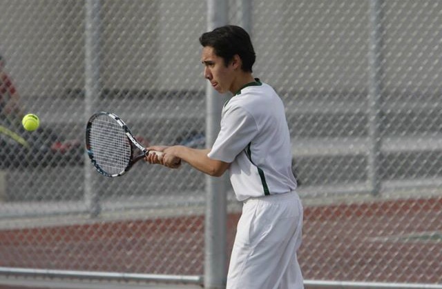 Senior Andrew Canlas hits the ball against East Union.