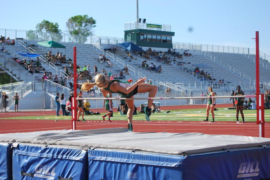 Karlie Brown is in the middle of her high jump.