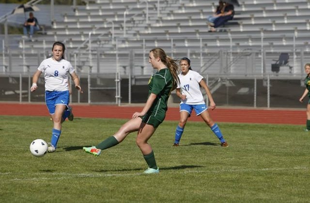 Sophomore Ashley Hallen kicks the ball against Sierra.
