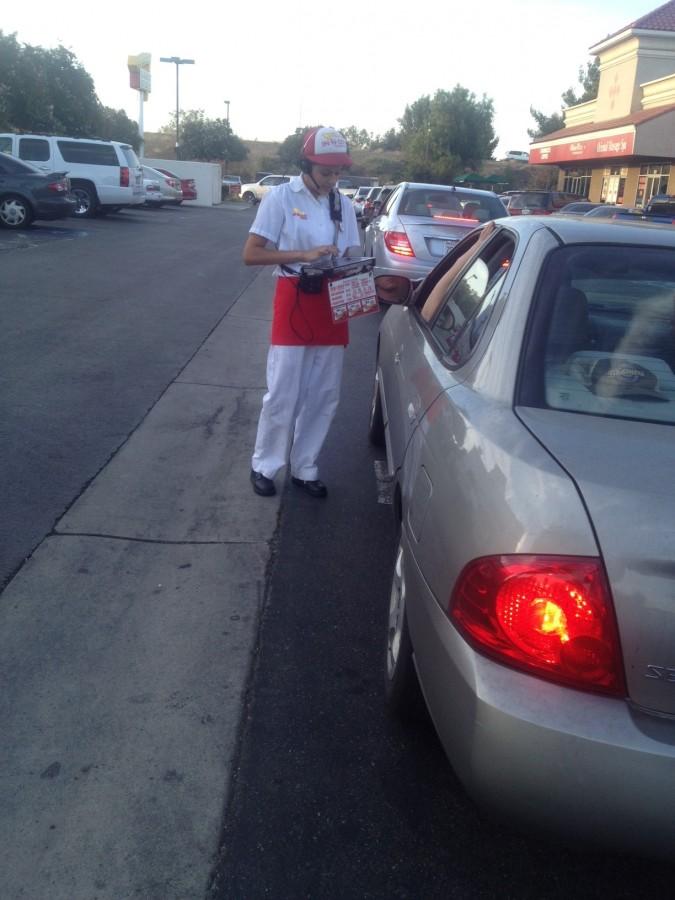 Senior Crista Robles taking orders  outside at In-N-Out  Burger 