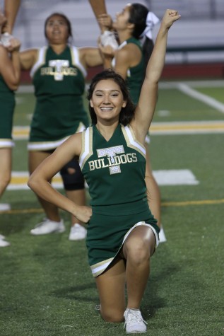 Junior Emily Vazquez cheers at the halftime show during the All-star Lions' football game.
