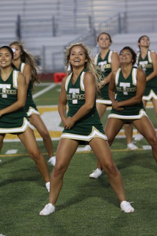 Senior Mattison Stokes cheers at the halftime show during the All-star Lions' football game.