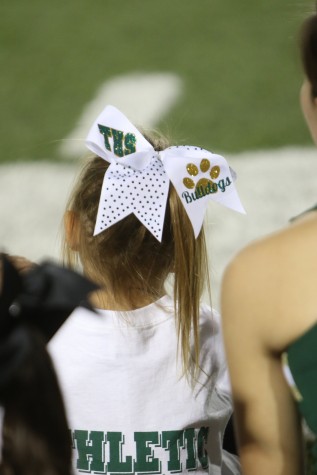 Cheer clinic student awaits her turn to perform at the halftime show of the varsity game, on Sept. 25.
