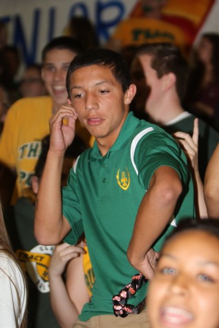 Senior Marcus Guillen dances in the crowd during the rally. 