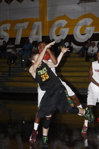 Senior Billy Shaddix going for a rebound against Edison from last year 
