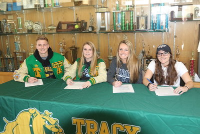 Jake Pranke, Samantha Farmer, Ashley Hallen, and Taylor Boren signing to play soccer at the college level