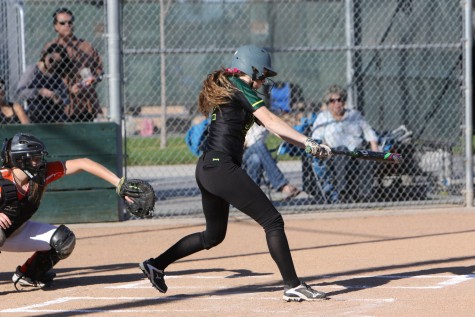 Senior Ali Davis swinging at a pitch against Kimball on March 1