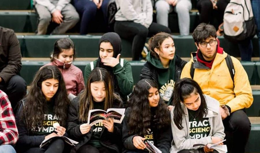 Part of the 2019-20 Tracy Science Olympiad team waits for the regional competitions awards ceremony to begin.