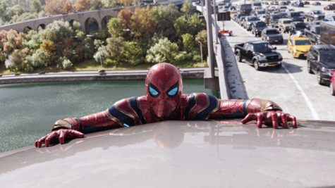 Spider-Man (Tom Holland) on a car during a battle. 
[Picture courtesy of Everett Collection and The Hollywood Reporter]