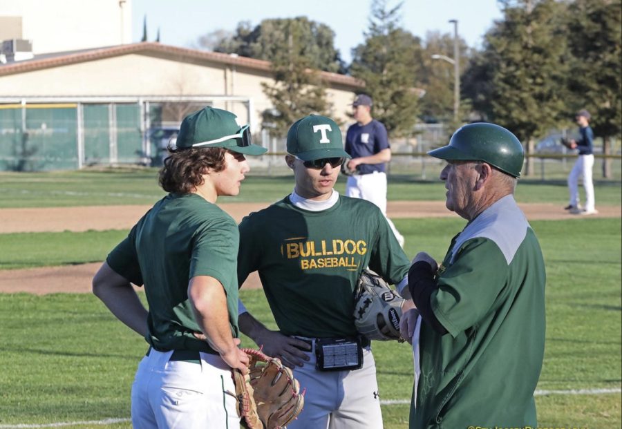 Drew Fredericks (12) with coach and teammate
[Picture courtesy of Stu Jossey]